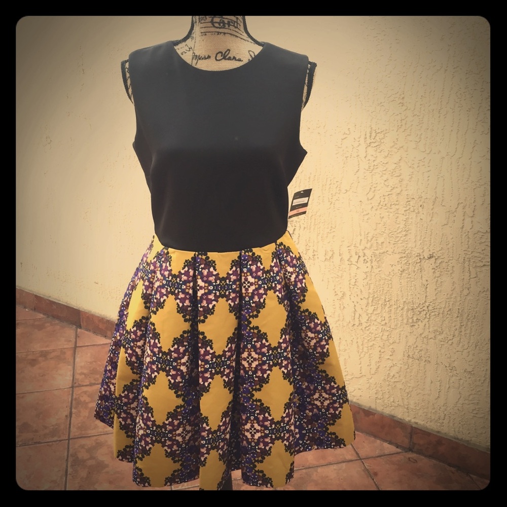 Black & mustard colored dress designed by Taylor